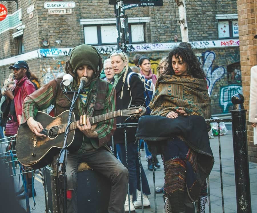 street performer in Brick Lane Market, London